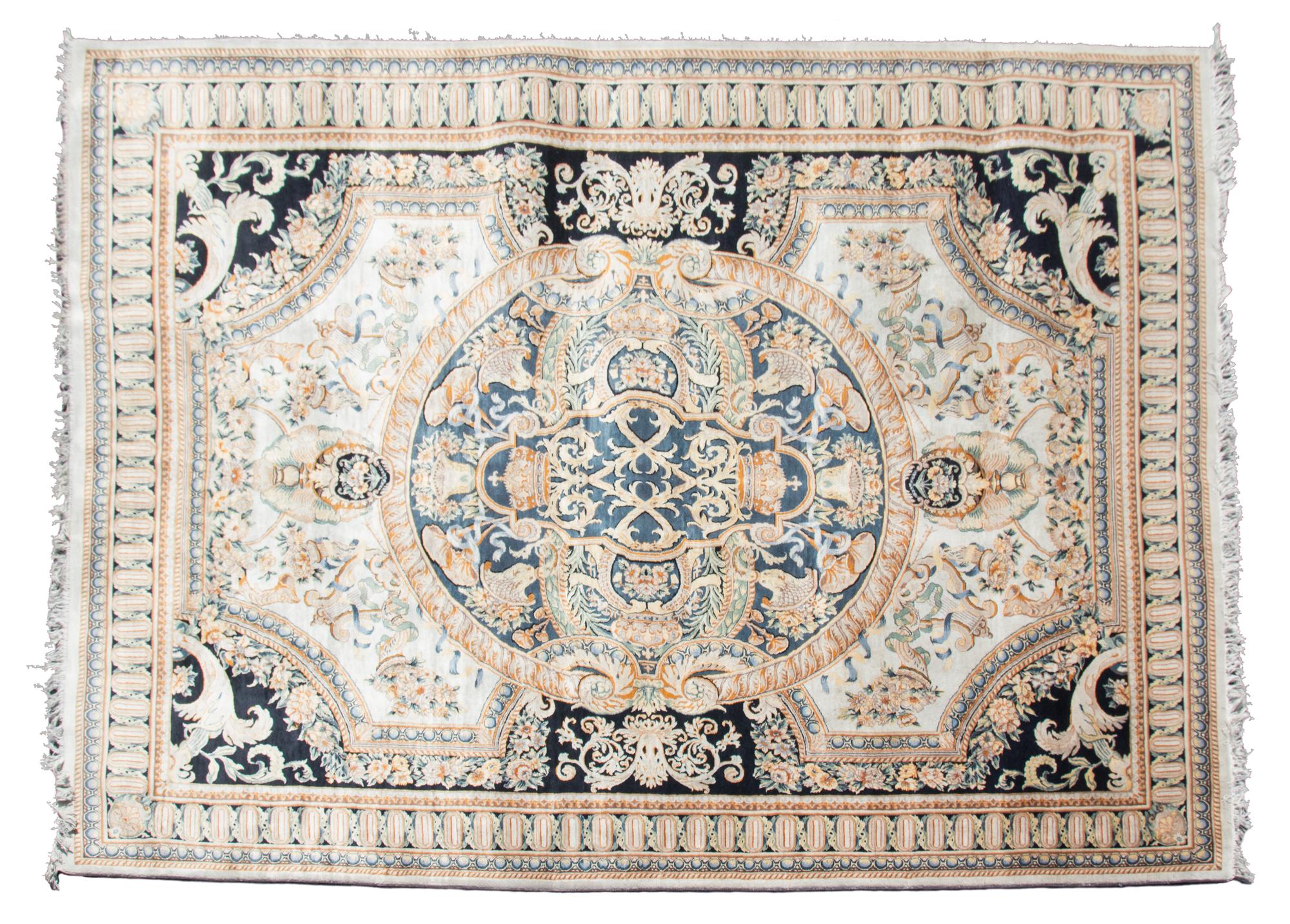 A Louis XVI Design Wool Rug by Safavieh 12 feet 5 inches x 9 feet.