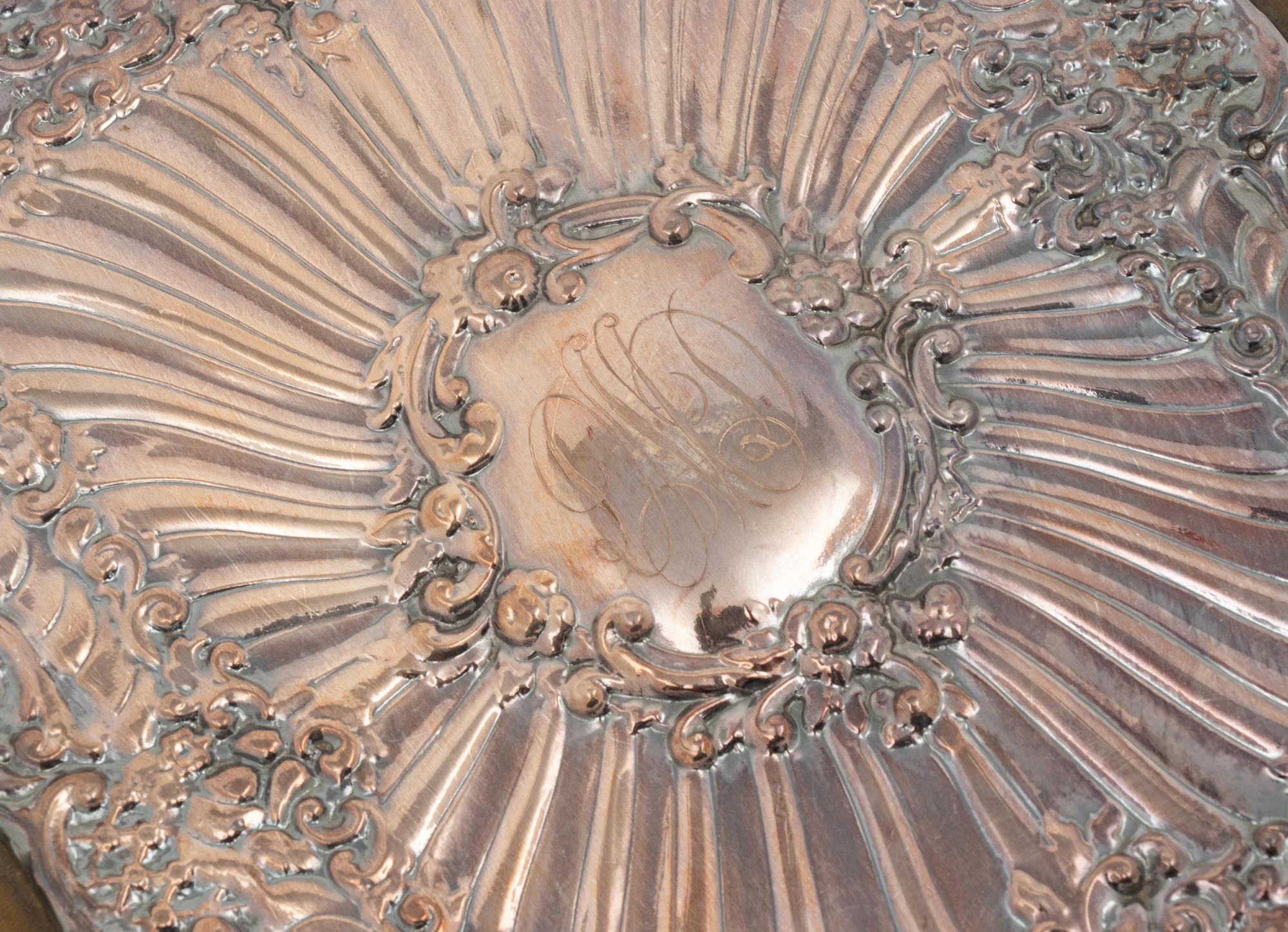 A Repoussé Silver-Mounted Leather Portfolio