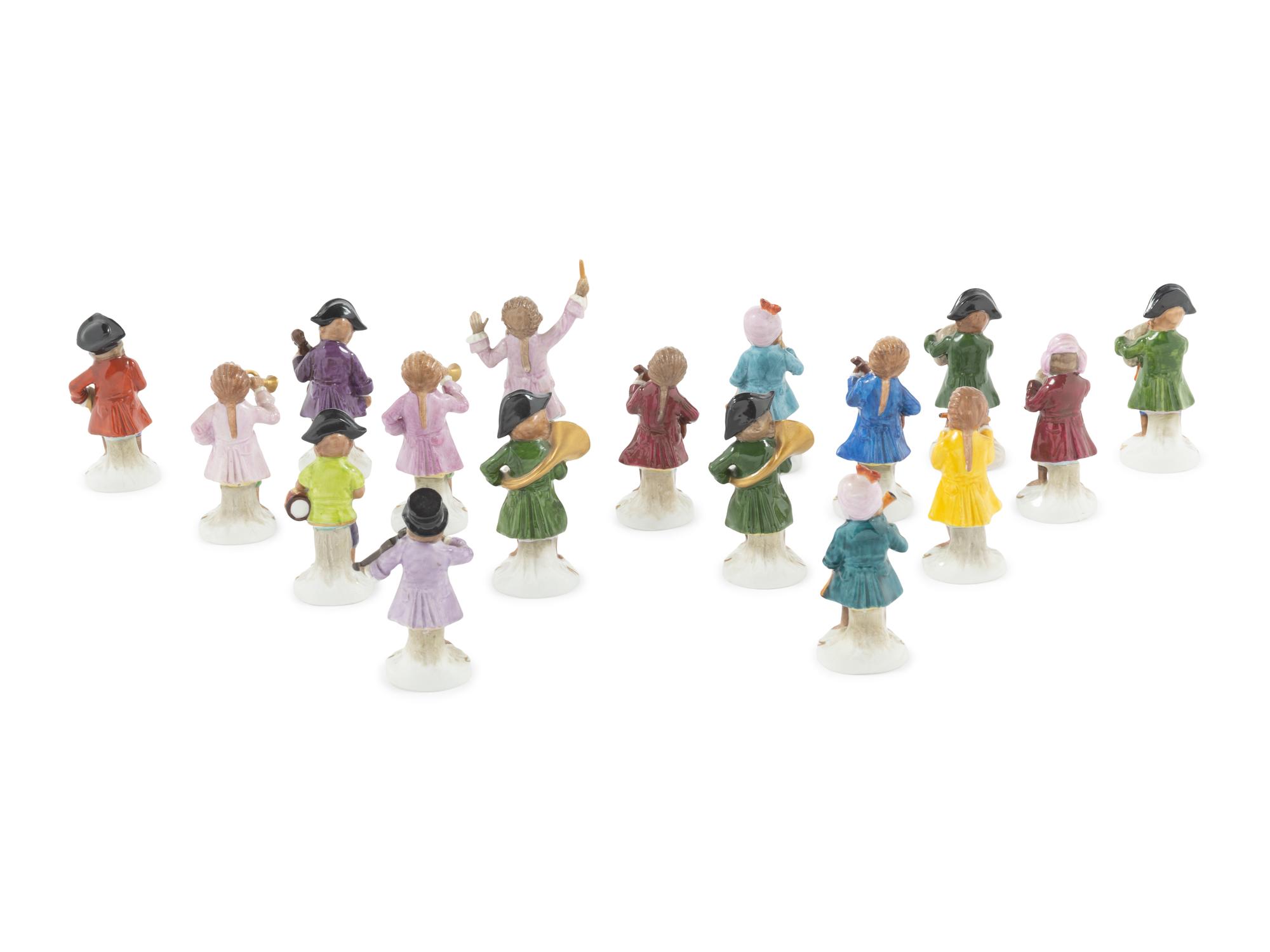 An Assembled Group of Seventeen Sitzendorf Porcelain Monkey Band Figures