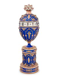A Gold, Enamel and Diamond Inset Egg-Form Annular Clock
