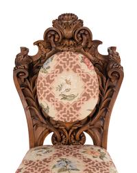 A Set of Six Rococo Revival Carved Oak Dining Chairs