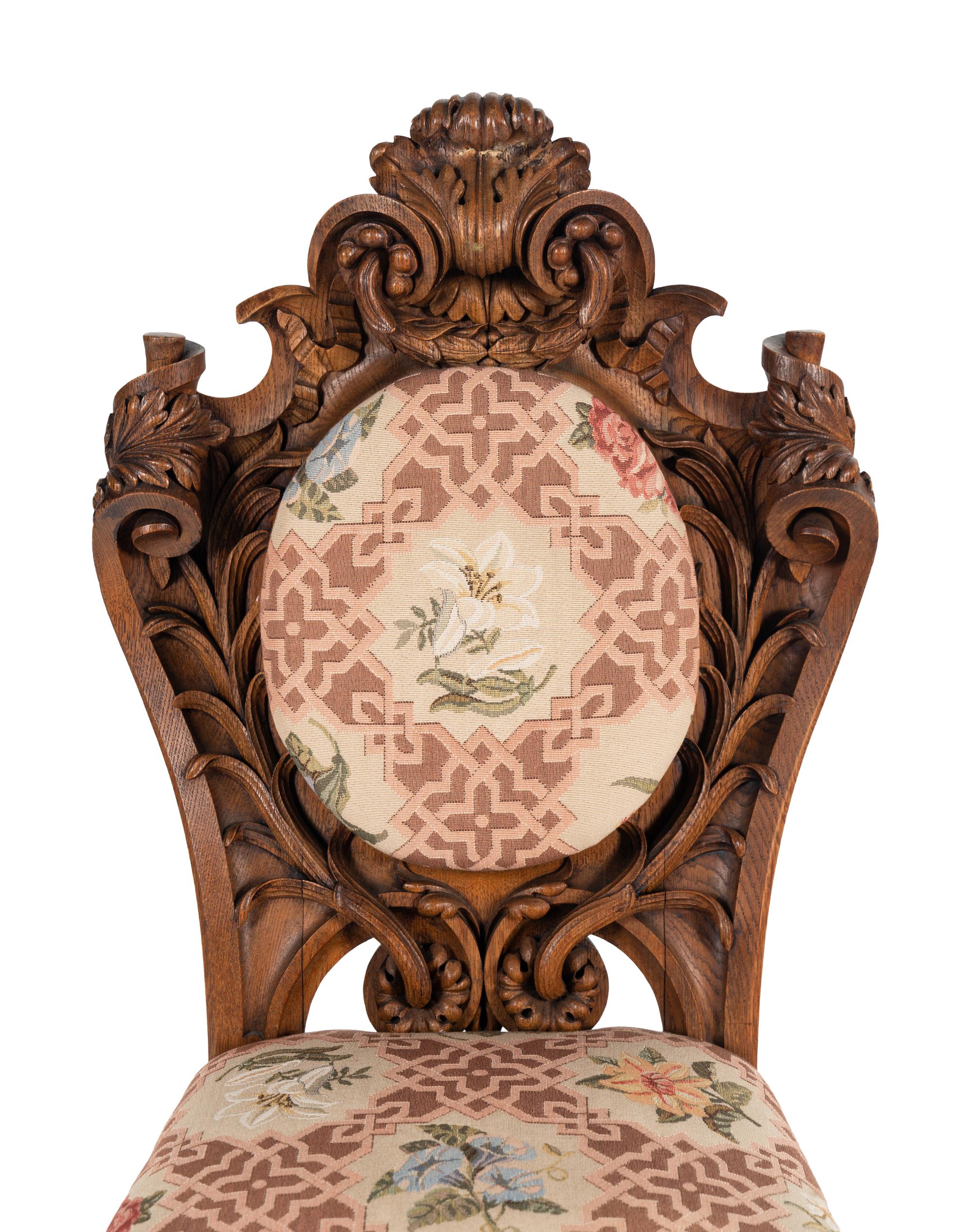 A Set of Six Rococo Revival Carved Oak Dining Chairs