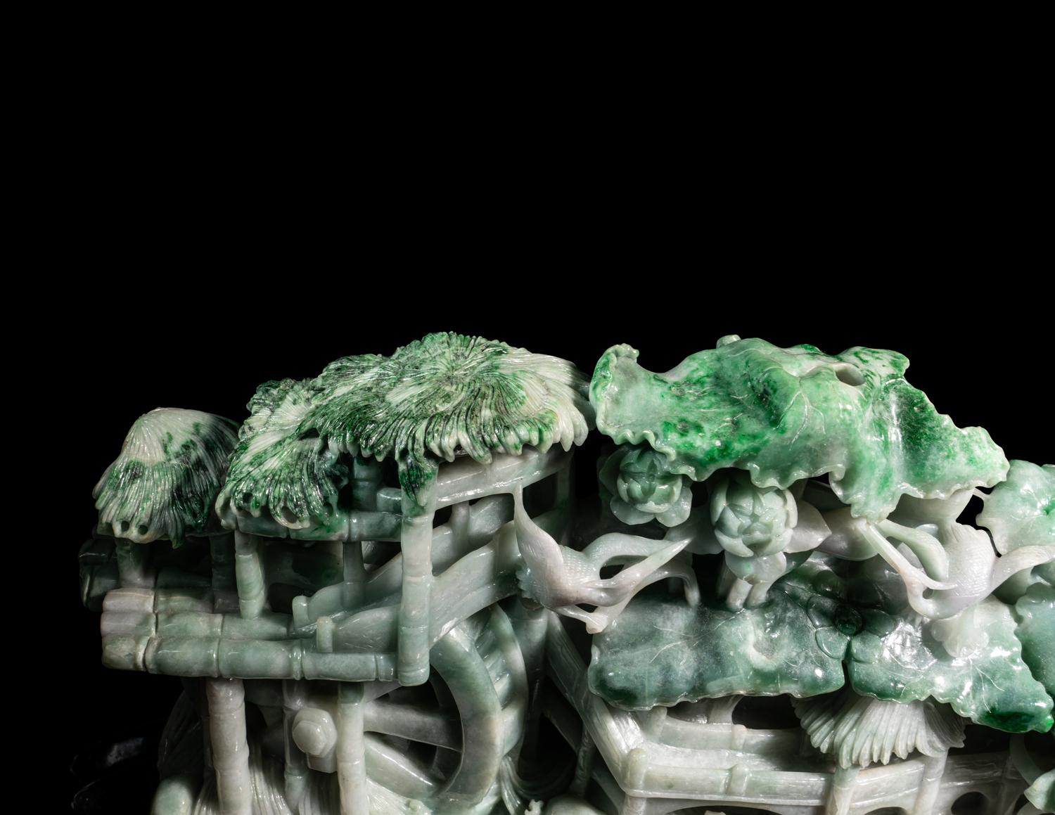 A Large Carved Apple Green and Celadon Jadeite Mountain