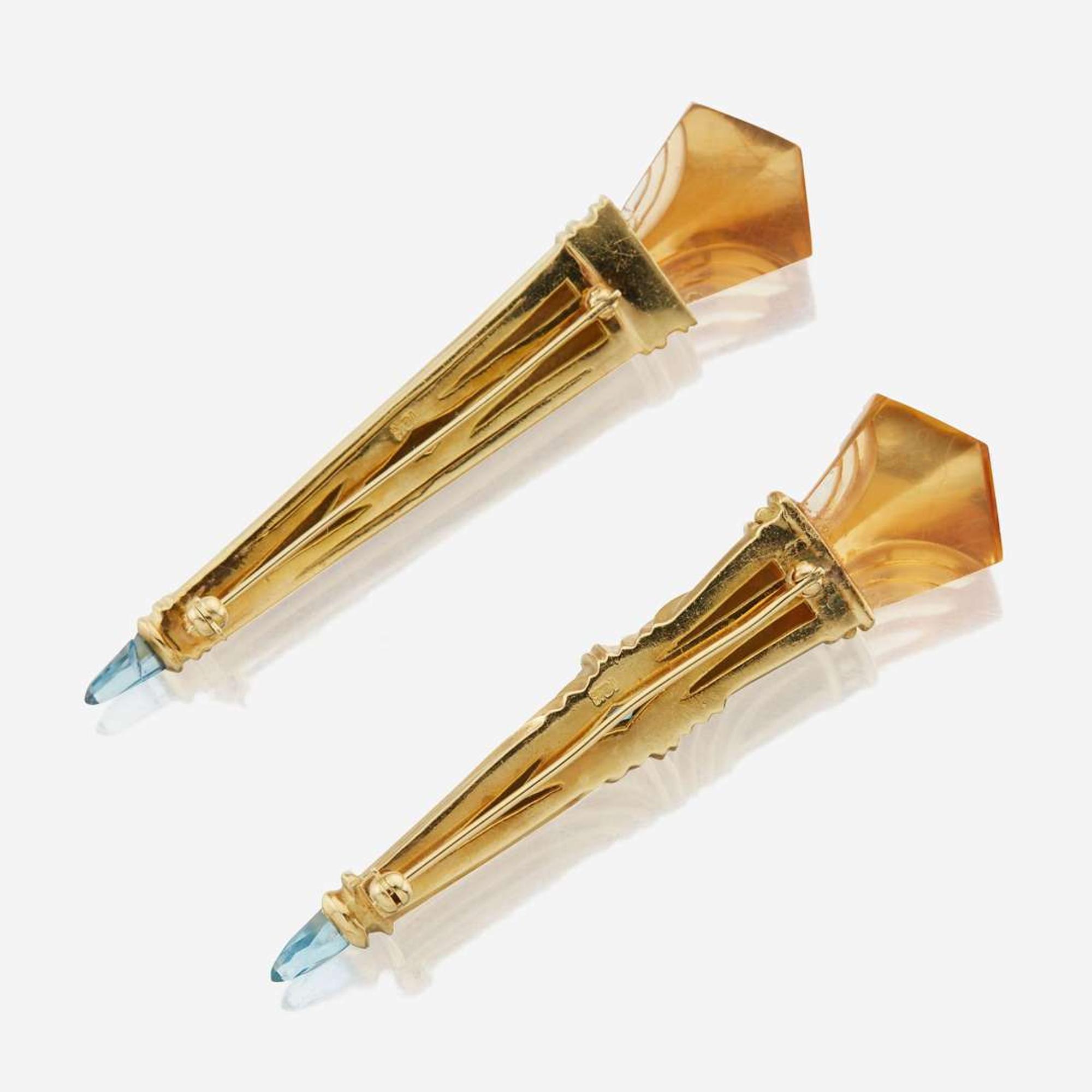 A pair of gold, citrine, aquamarine, and blue topaz brooches