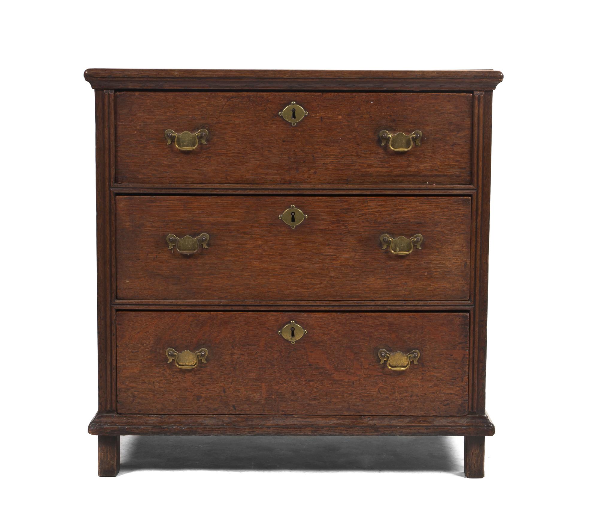 A George III Diminutive Oak Chest of Drawers, Height 31 1/4 x width 31 x depth 20 1/2 inches.