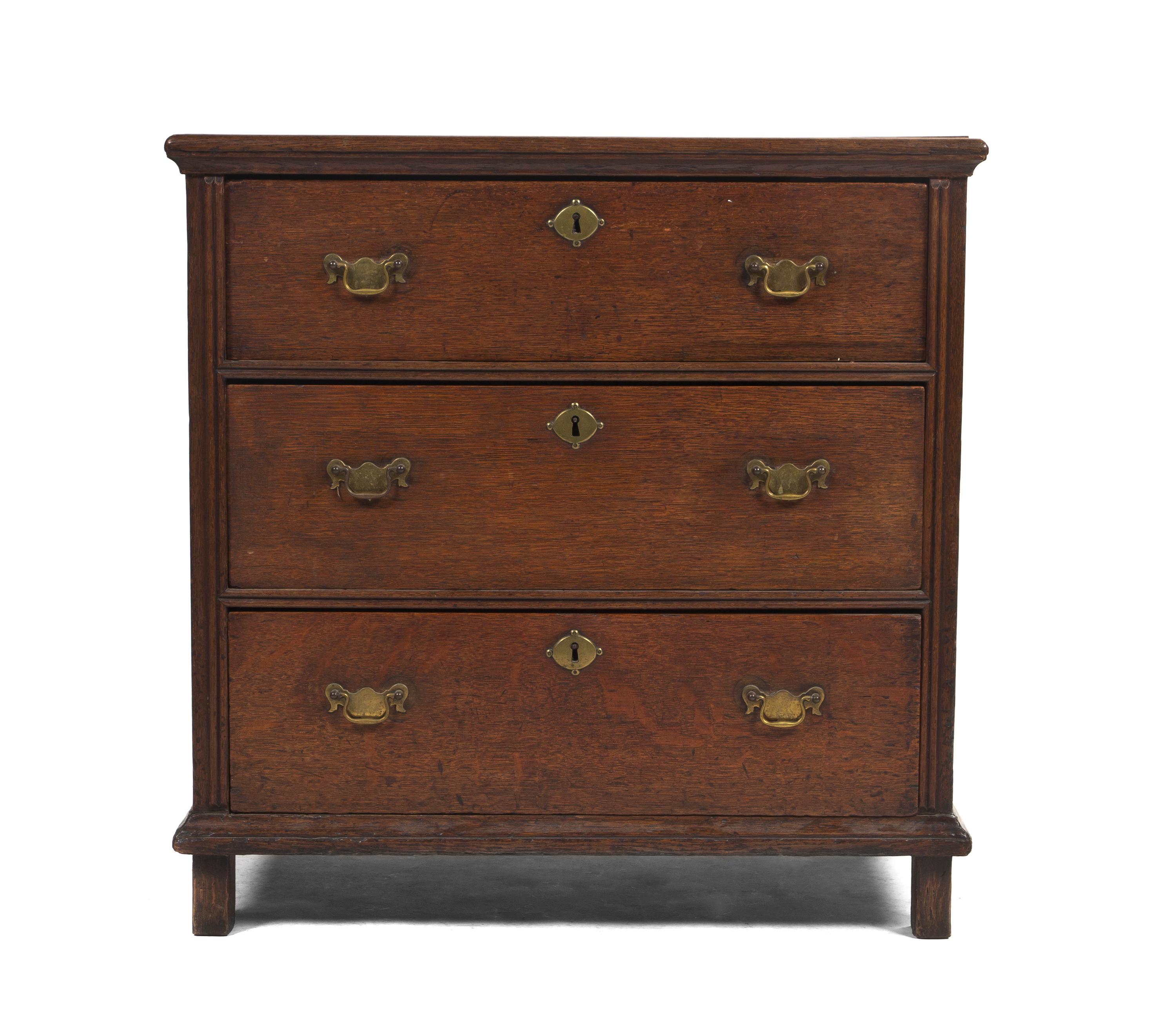 A George III Diminutive Oak Chest of Drawers, Height 31 1/4 x width 31 x depth 20 1/2 inches.