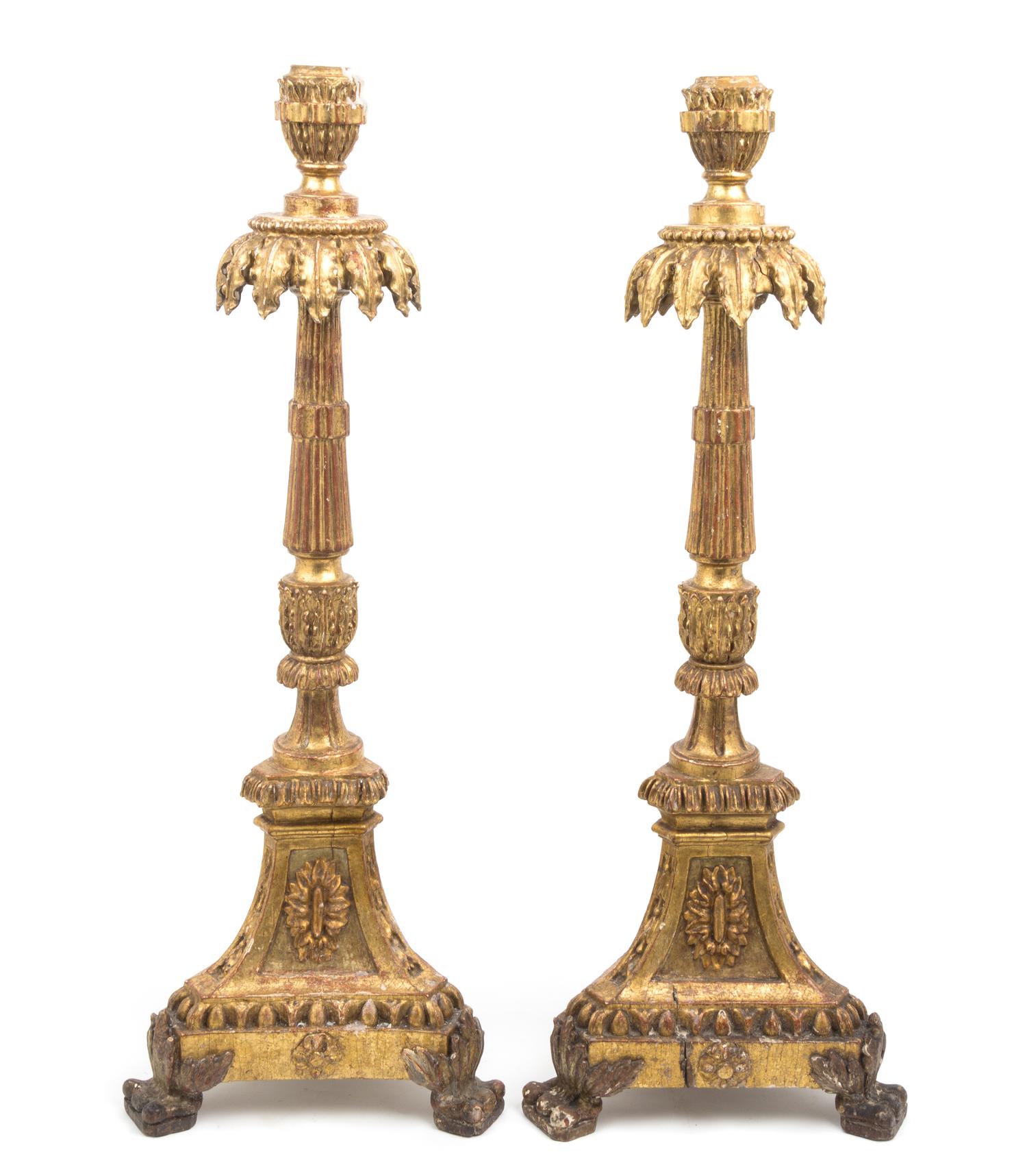 A Pair of Italian Neoclassical Giltwood Altar Candlesticks Height 31 inches.