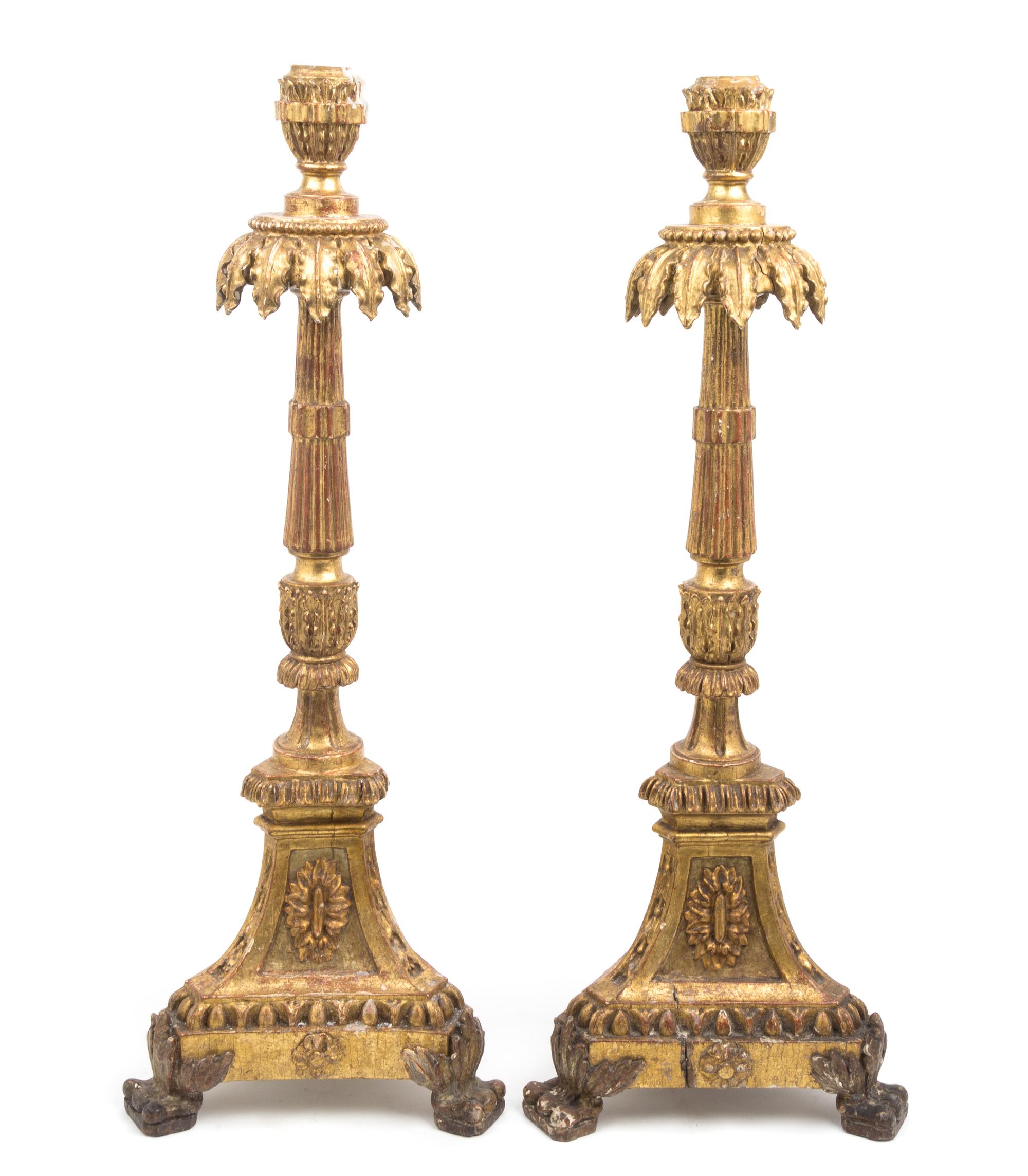 A Pair of Italian Neoclassical Giltwood Altar Candlesticks Height 31 inches.