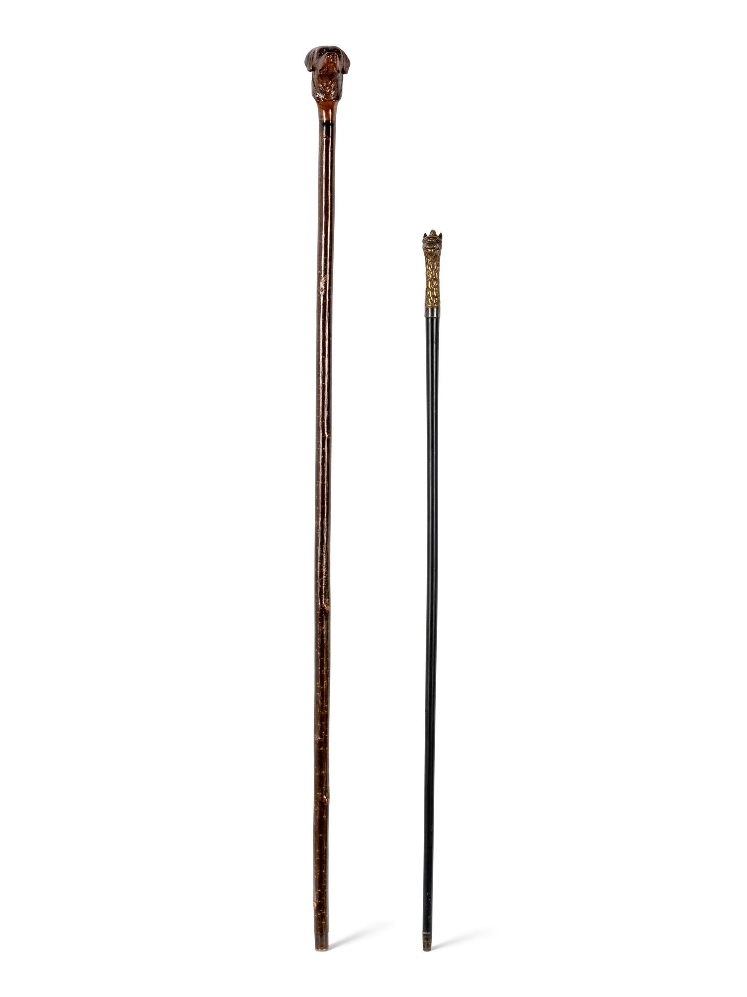 Two Figural Walking Sticks or Canes