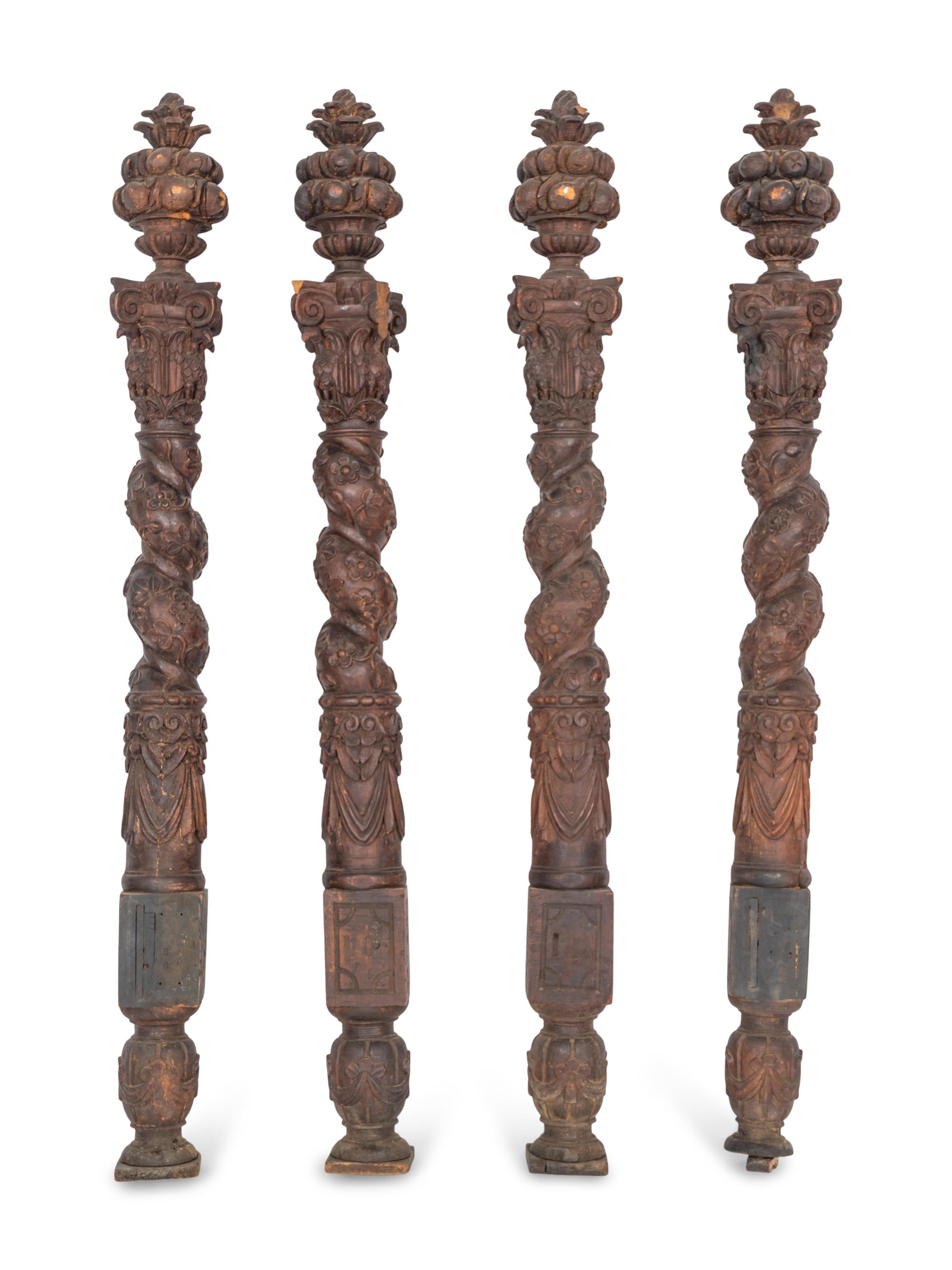 A Set of Four Continental Baroque Carved Walnut Bed Posts