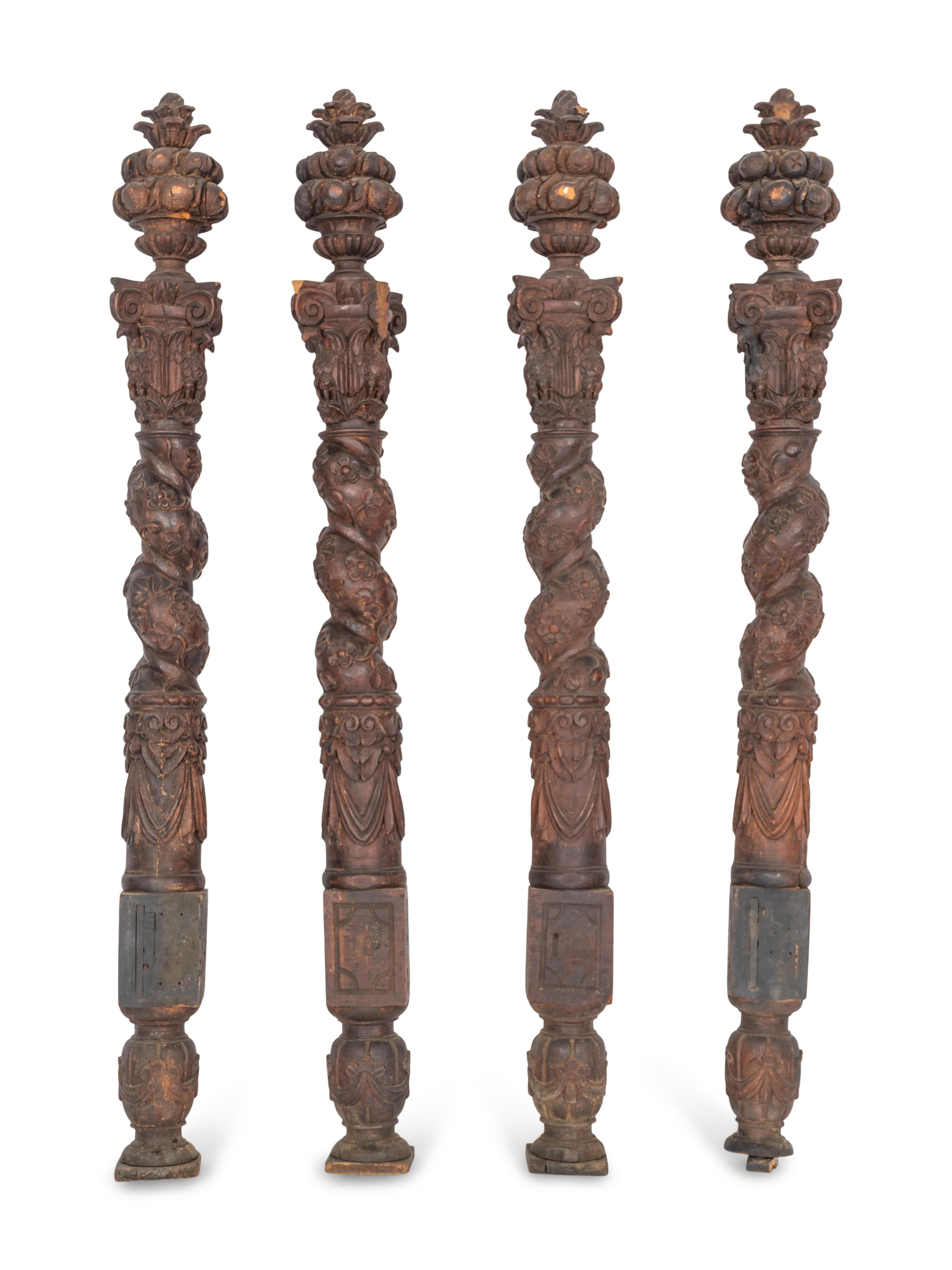 A Set of Four Continental Baroque Carved Walnut Bed Posts