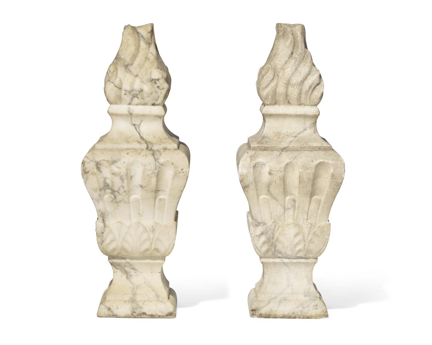 A pair of Italian carved white marble flame finials, 17th / 18th century