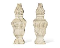 A pair of Italian carved white marble flame finials, 17th / 18th century