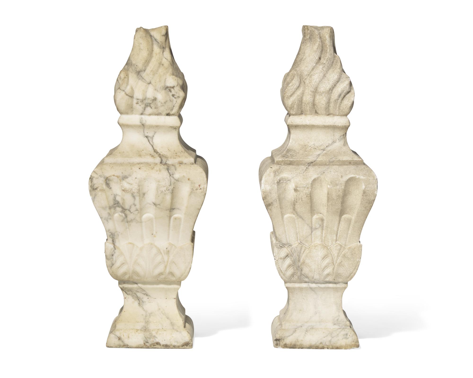 A pair of Italian carved white marble flame finials, 17th / 18th century