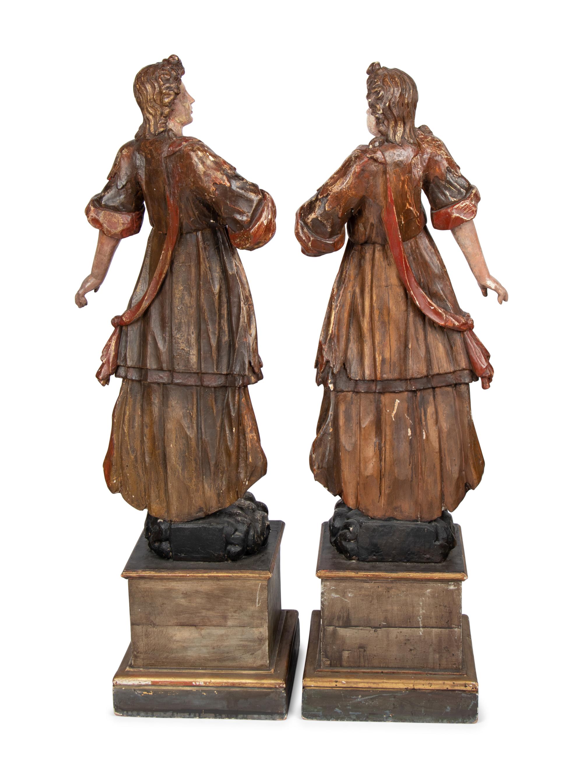 A Pair of Italian Painted and Parcel Gilt Figures of Saints