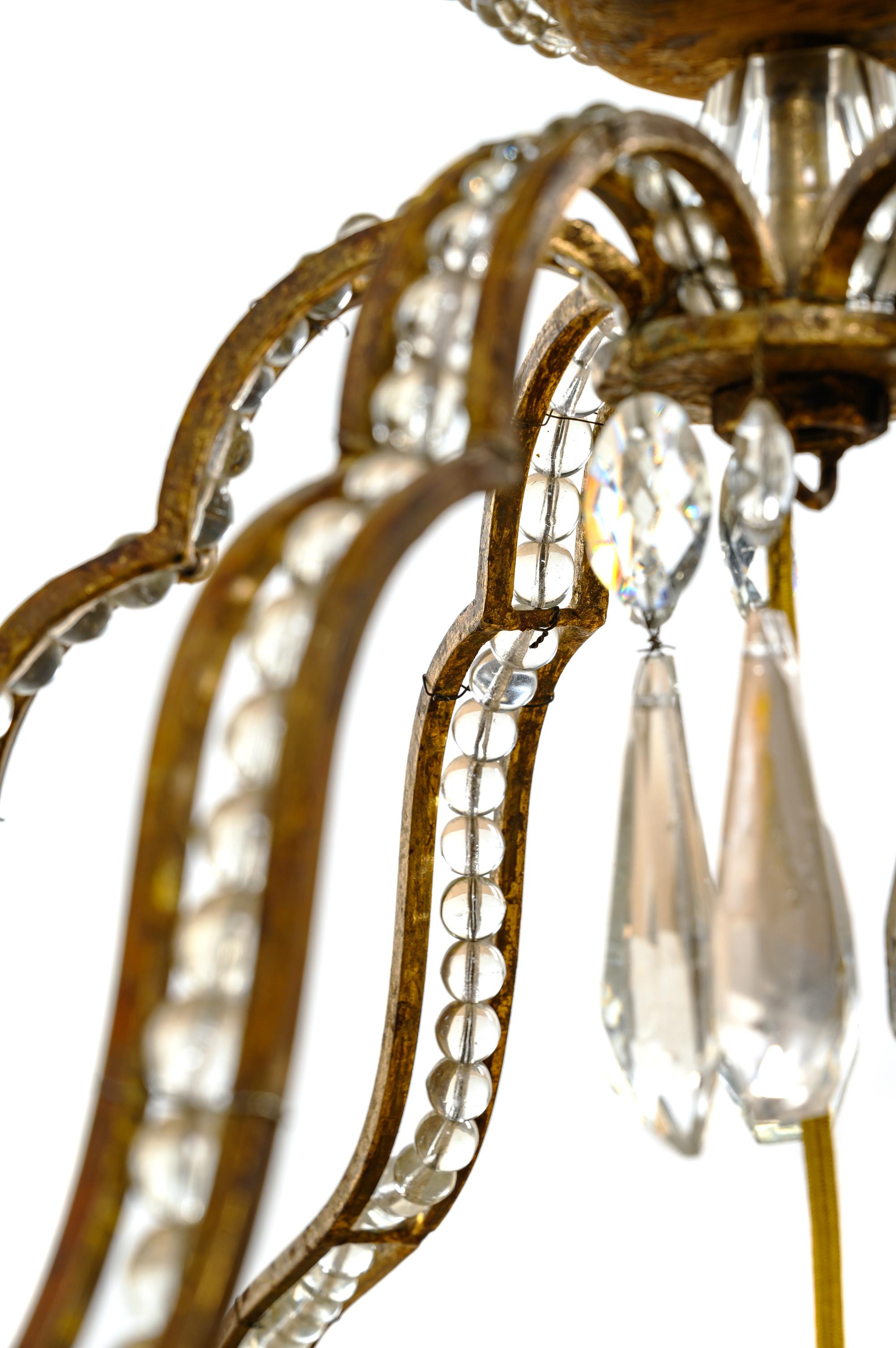 An Italian Beaded Gilt Metal Six-Light Chandelier with a Rope Canopy