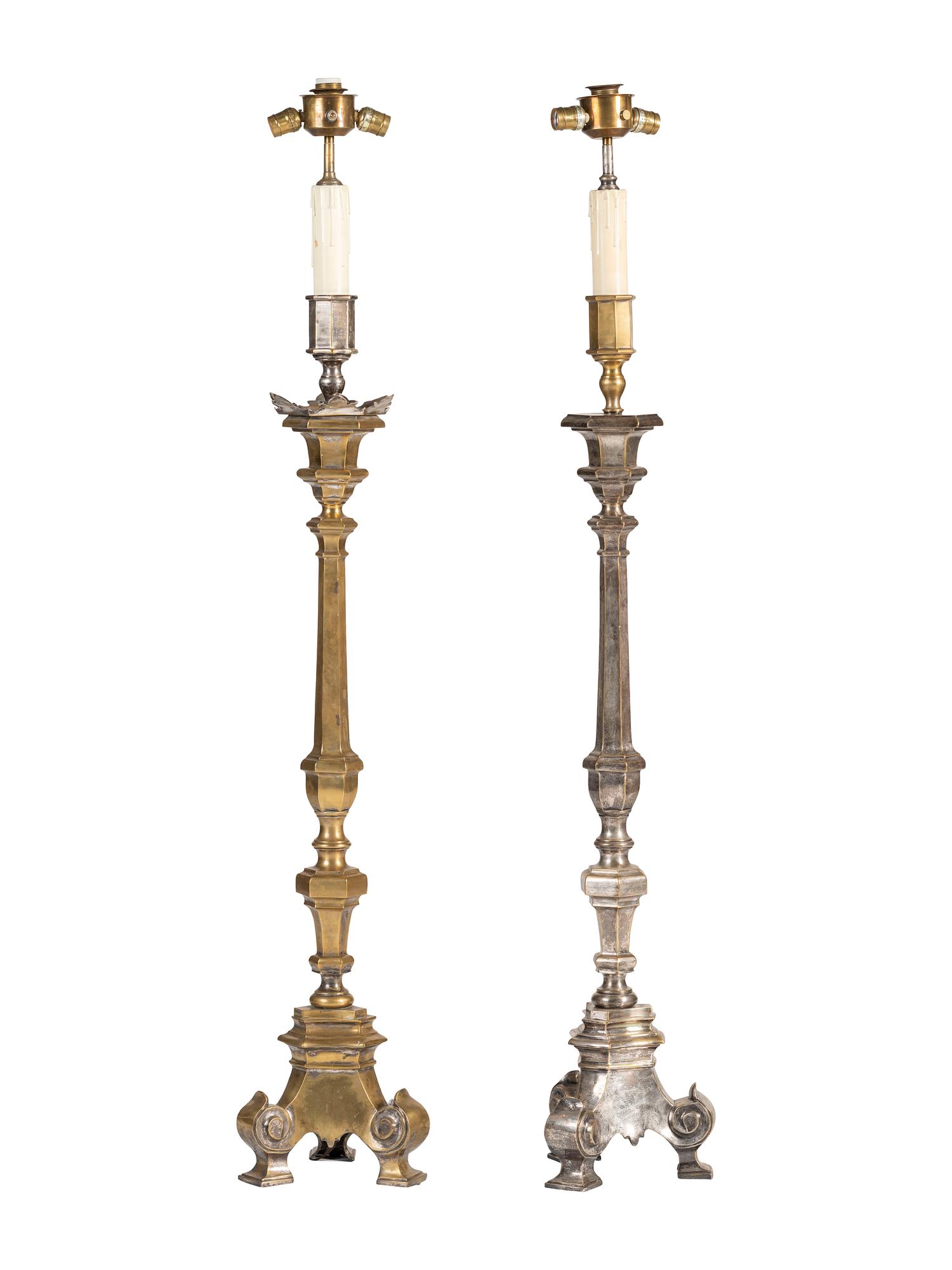 A Pair of Continental Baroque Style Silvered Brass Floor Candlestands