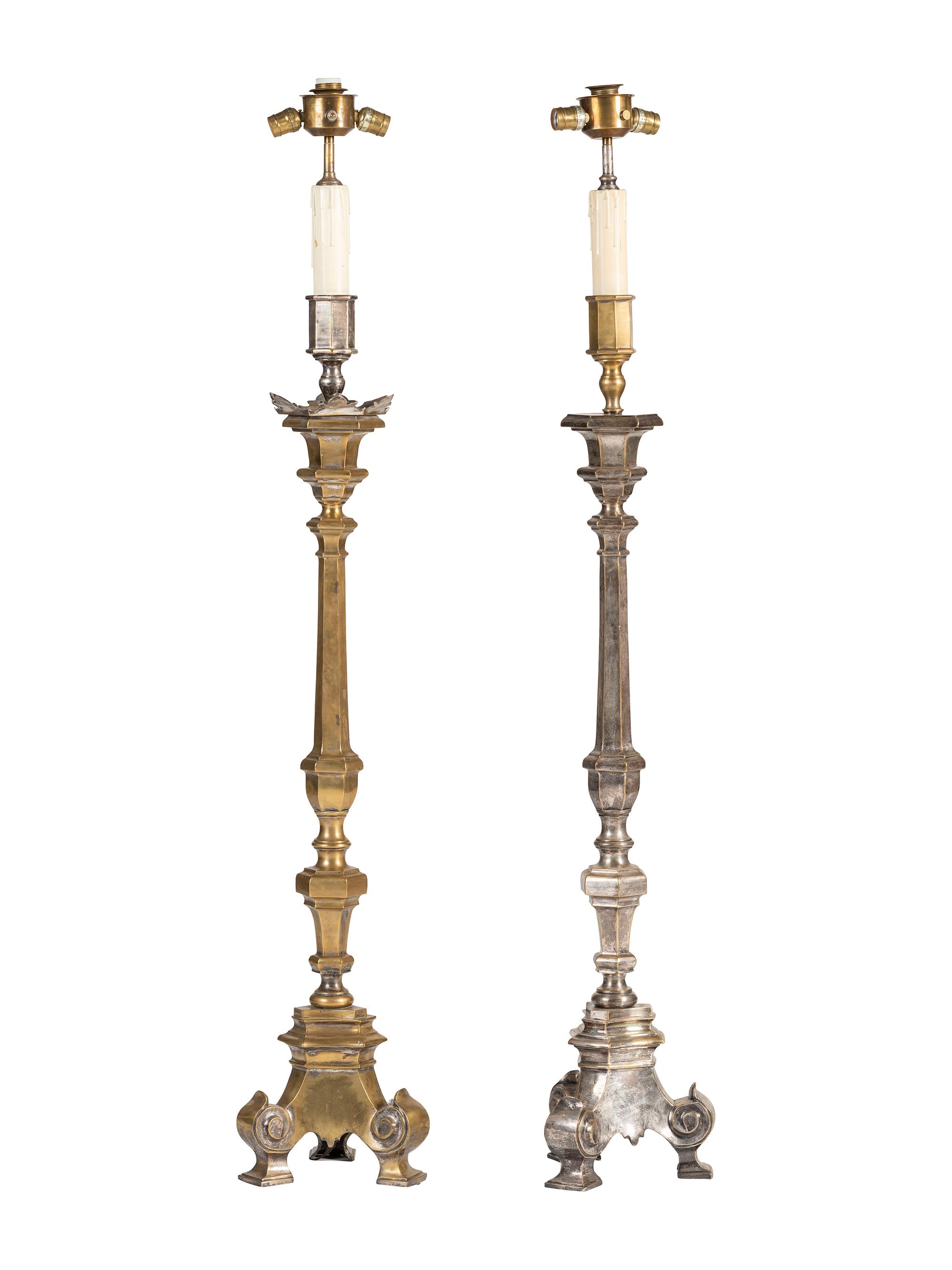 A Pair of Continental Baroque Style Silvered Brass Floor Candlestands