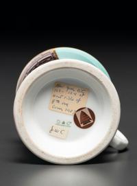 A Paint Enhanced Photographic Transfer Porcelain Occupational Shaving Mug Depicting a Tailor's Shop