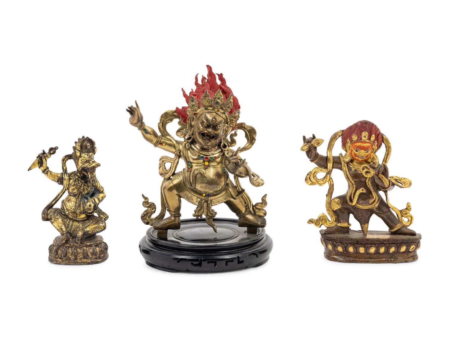 Three Tibetan Gilt Bronze Figures of Guardians