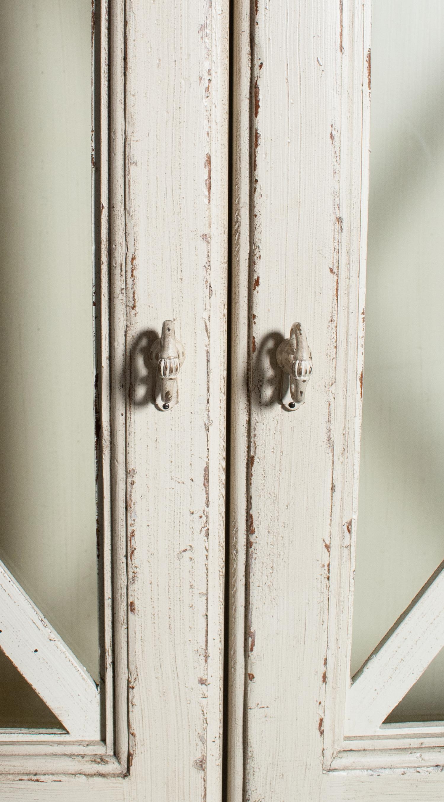 A Pair of Drexel Heritage Neoclassical Style Painted Glazed Door Cabinets