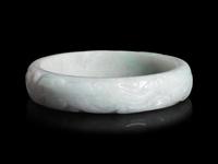 A Large Chinese Carved Jadeite Bangle