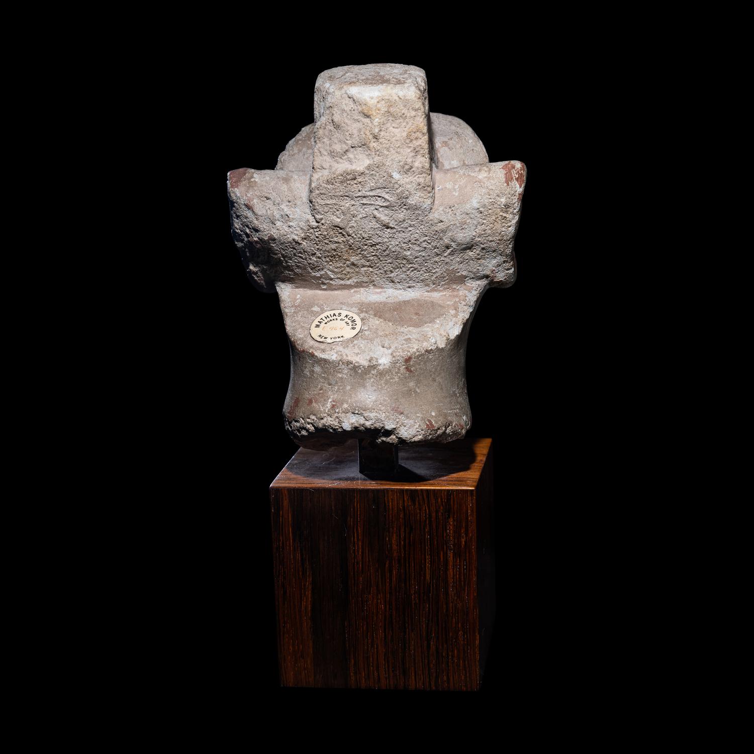An Egyptian Limestone Head from a Composite Statue