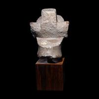 An Egyptian Limestone Head from a Composite Statue