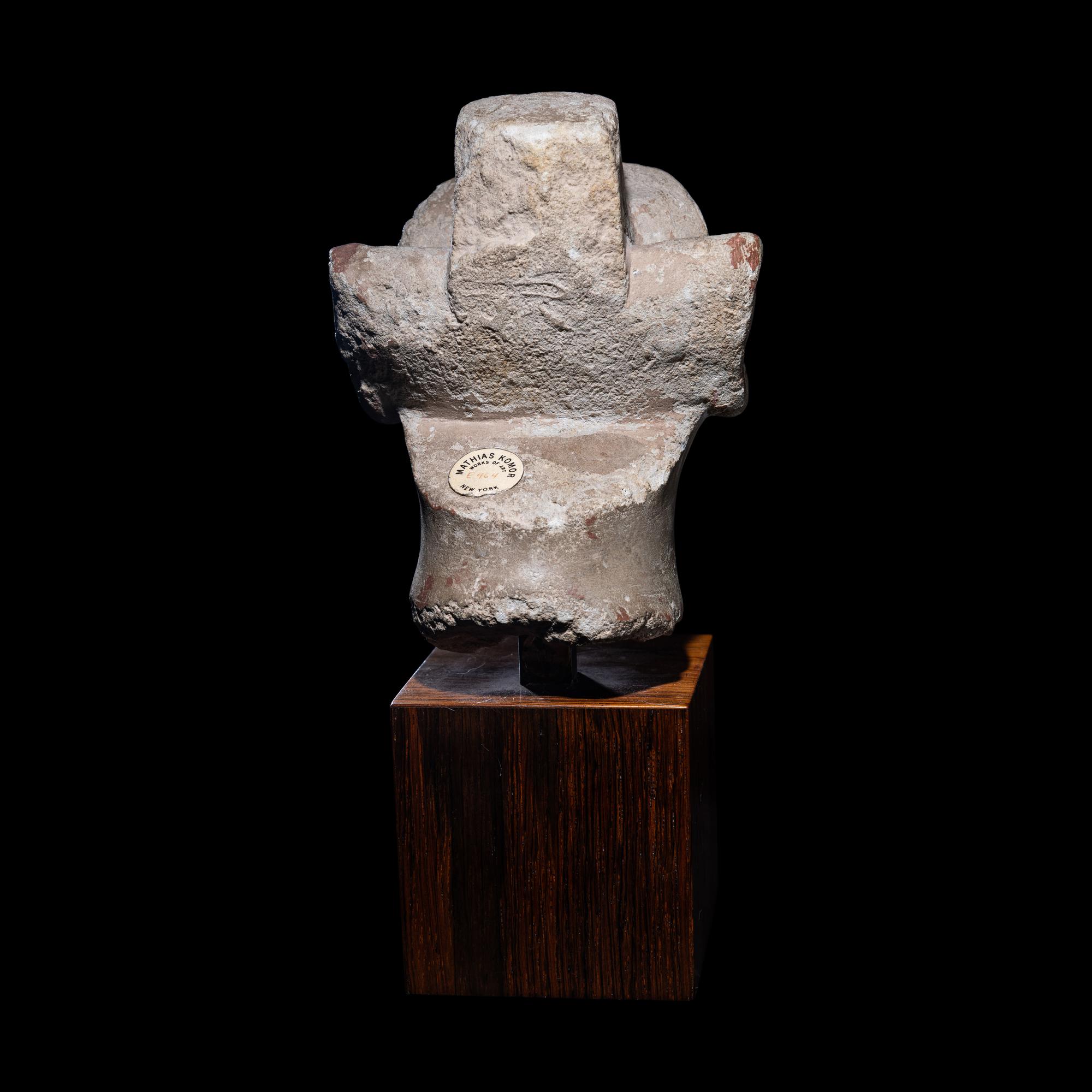 An Egyptian Limestone Head from a Composite Statue