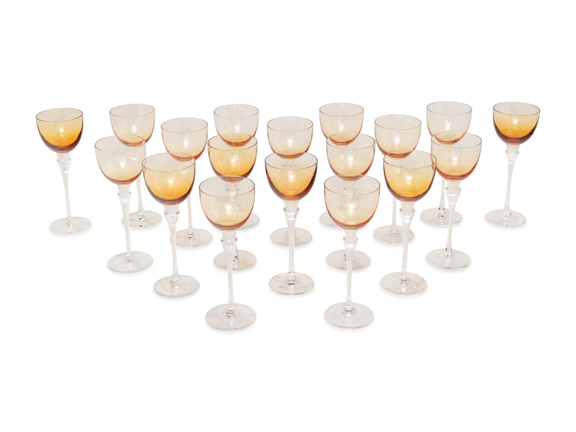 A Set of Eighteen St. Louis Grand Lieu Amber Glass Hock Wine Stems