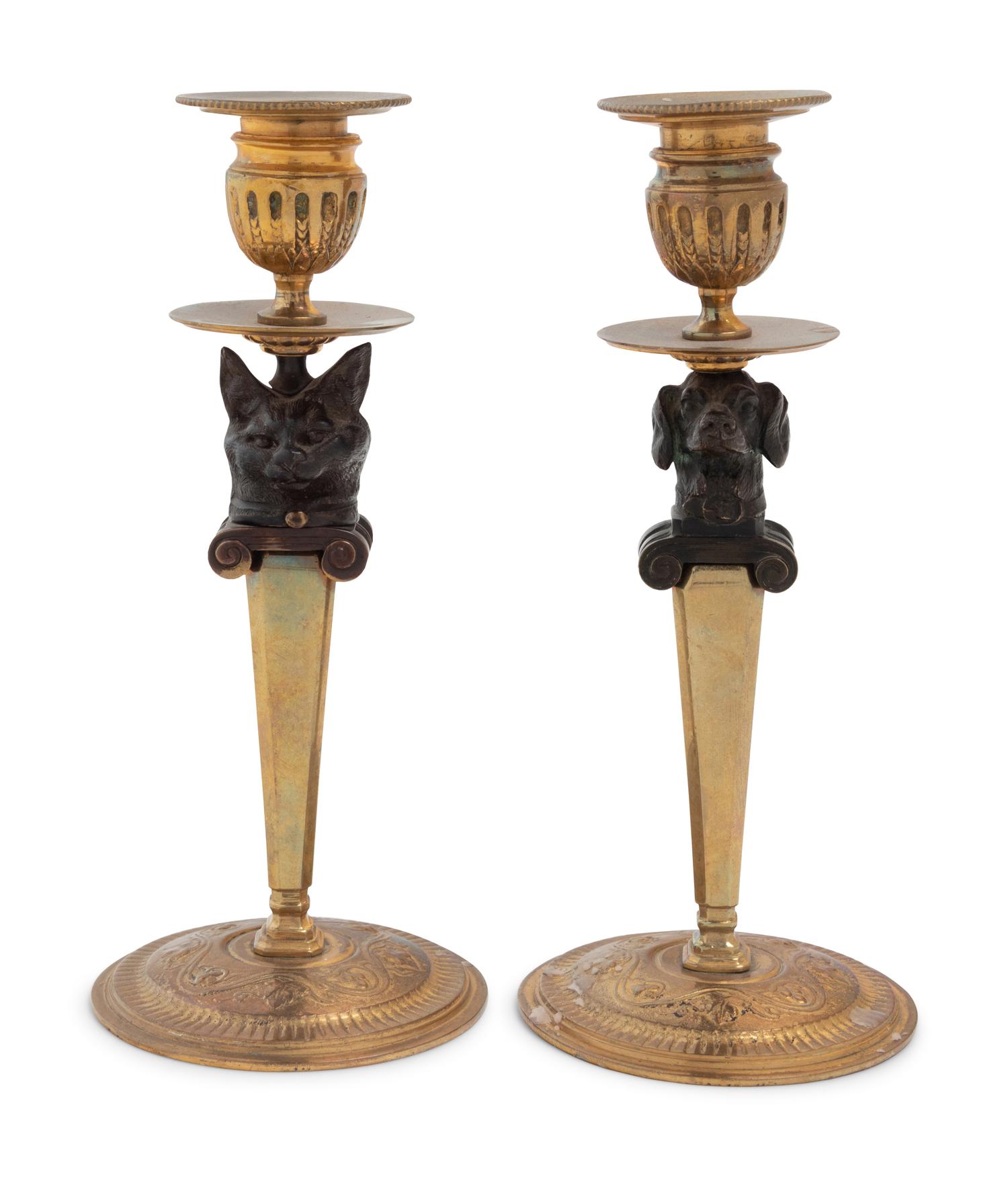 A Pair of Continental Gilt and Patinated Bronze Figural Candlesticks