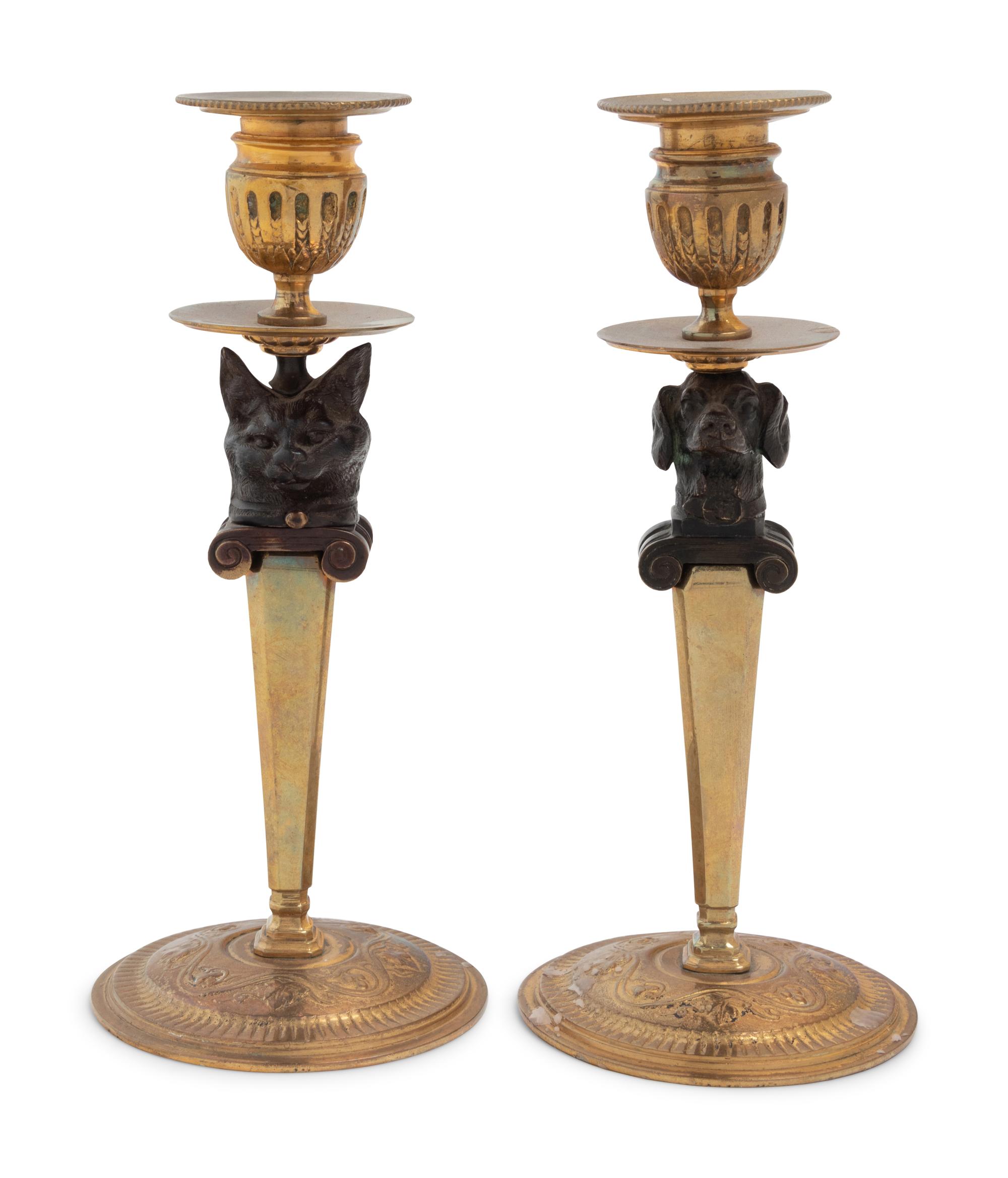 A Pair of Continental Gilt and Patinated Bronze Figural Candlesticks