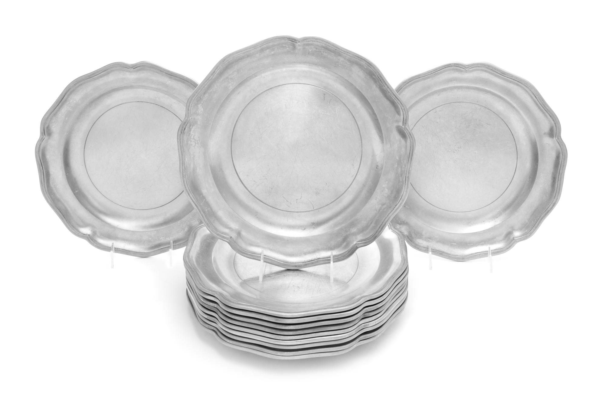 A Set of Twelve Pewter Chargers Diameter 12 inches. — STEDE