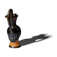 A Greek Painted Terracotta Figural Oinochoe