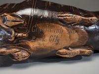 An Anna Pottery Incised and Brown Glazed Pig Flask