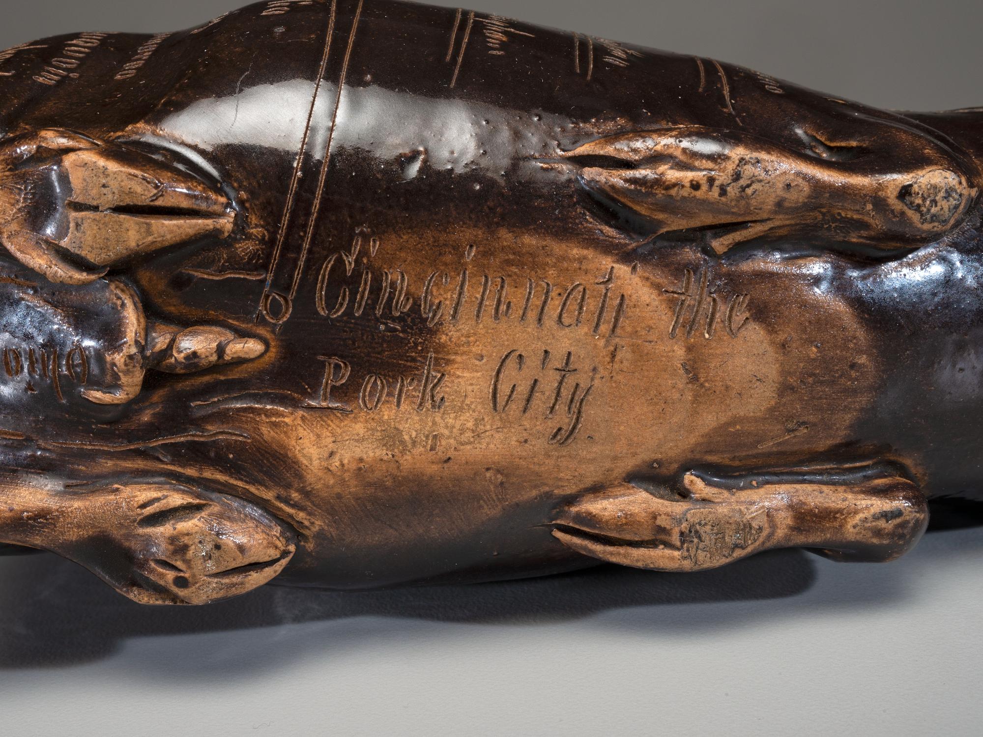An Anna Pottery Incised and Brown Glazed Pig Flask
