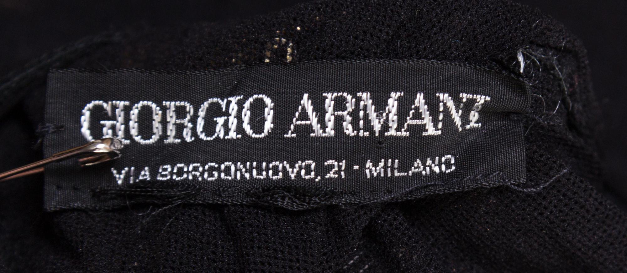 A Giorgio Armani Black Net and Gold Sequin Bodysuit,