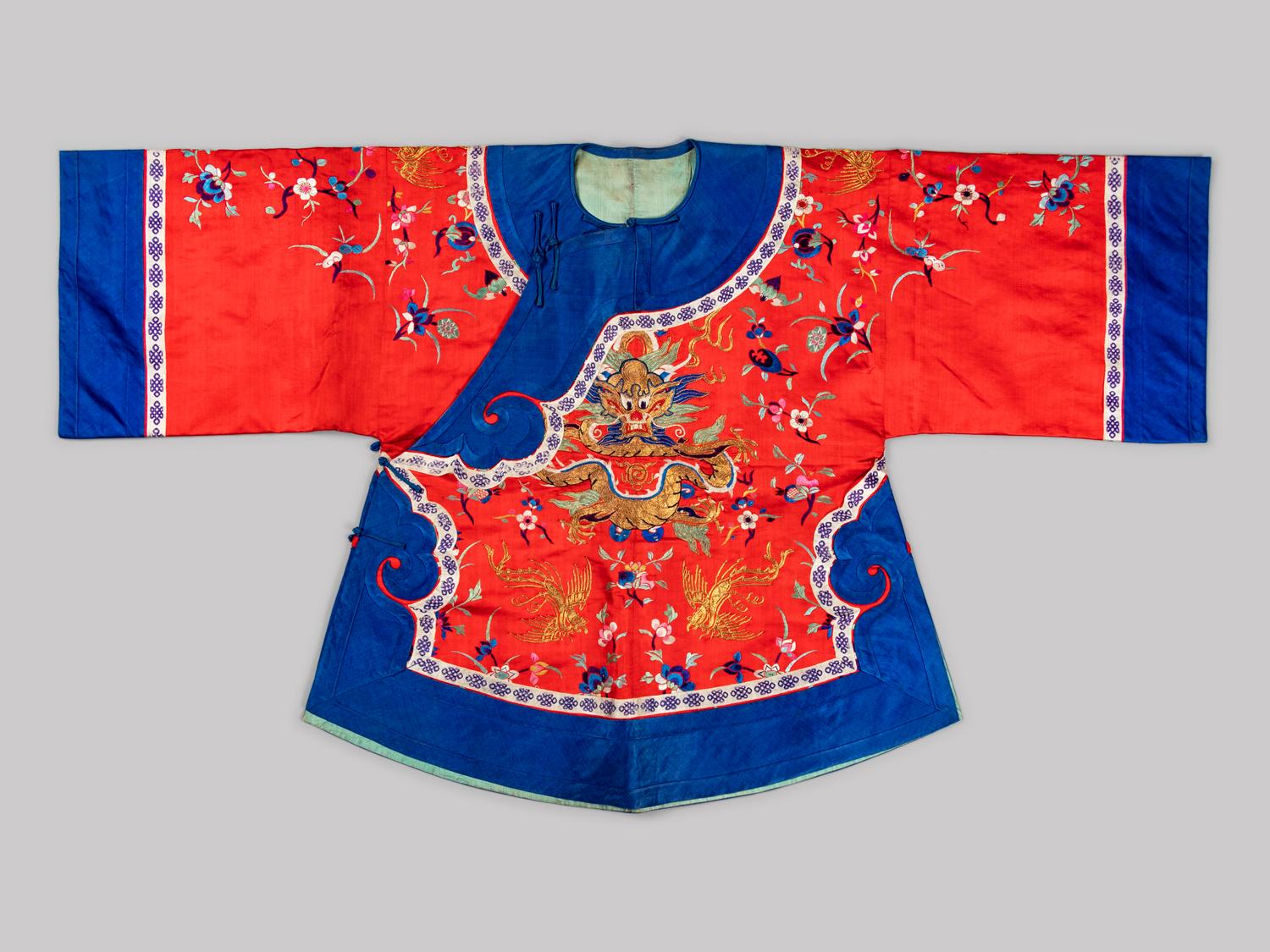 A Chinese Red Ground Embroidered Silk Ladies' Jacket