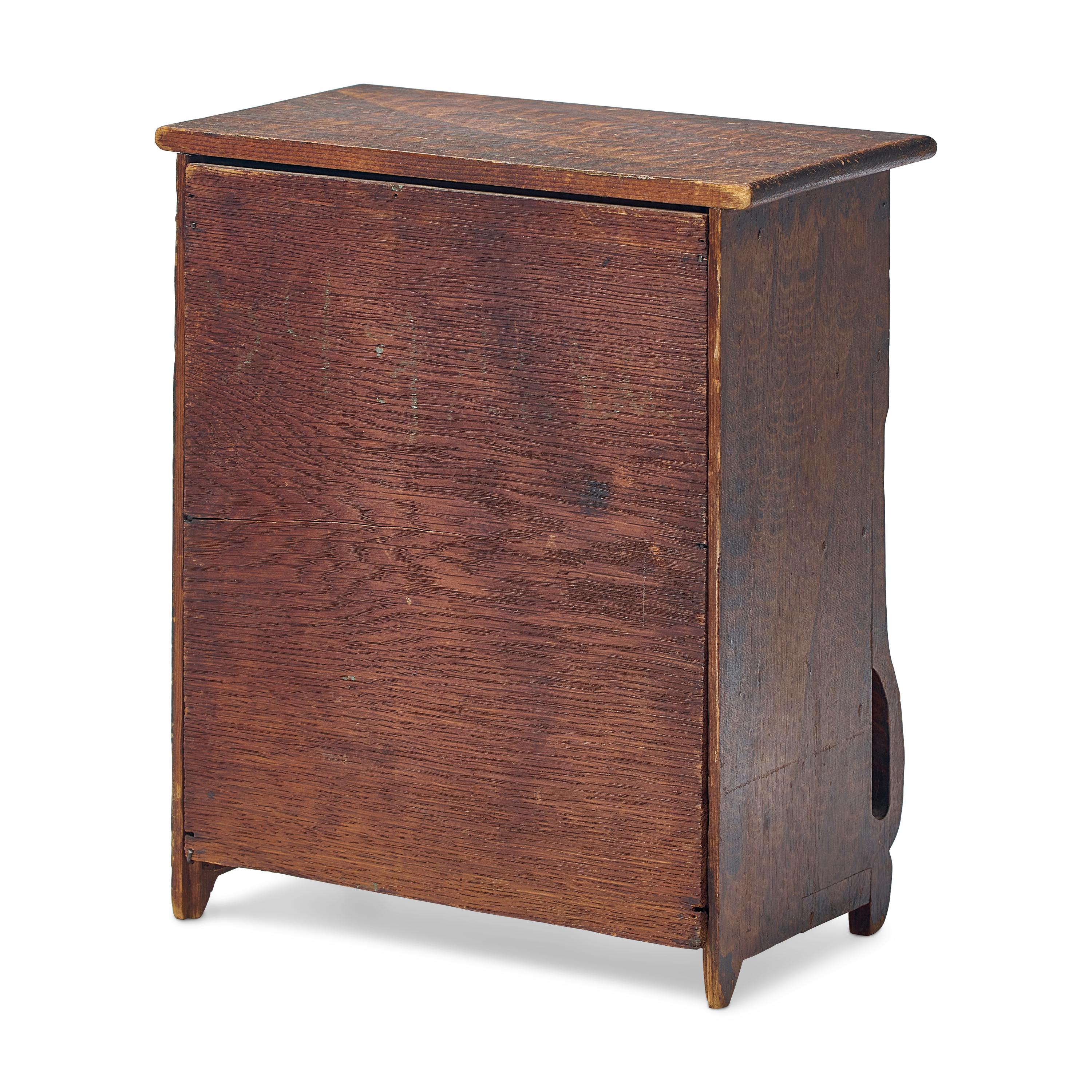 A Classical Grain Painted Pine Miniature Chest of Drawers