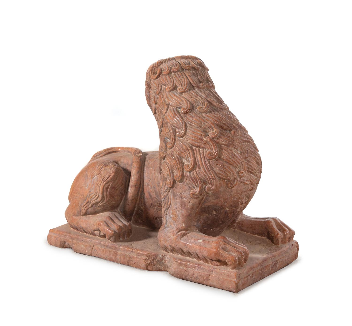 A Continental Carved Figure of a Recumbent Lion