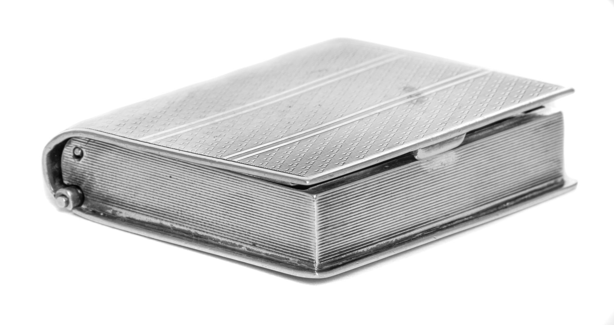 A French Silver Travel Clock, Georges Meyer, First Half 20th Century, in the form of a book, opening to a rectangular dial with Arabic