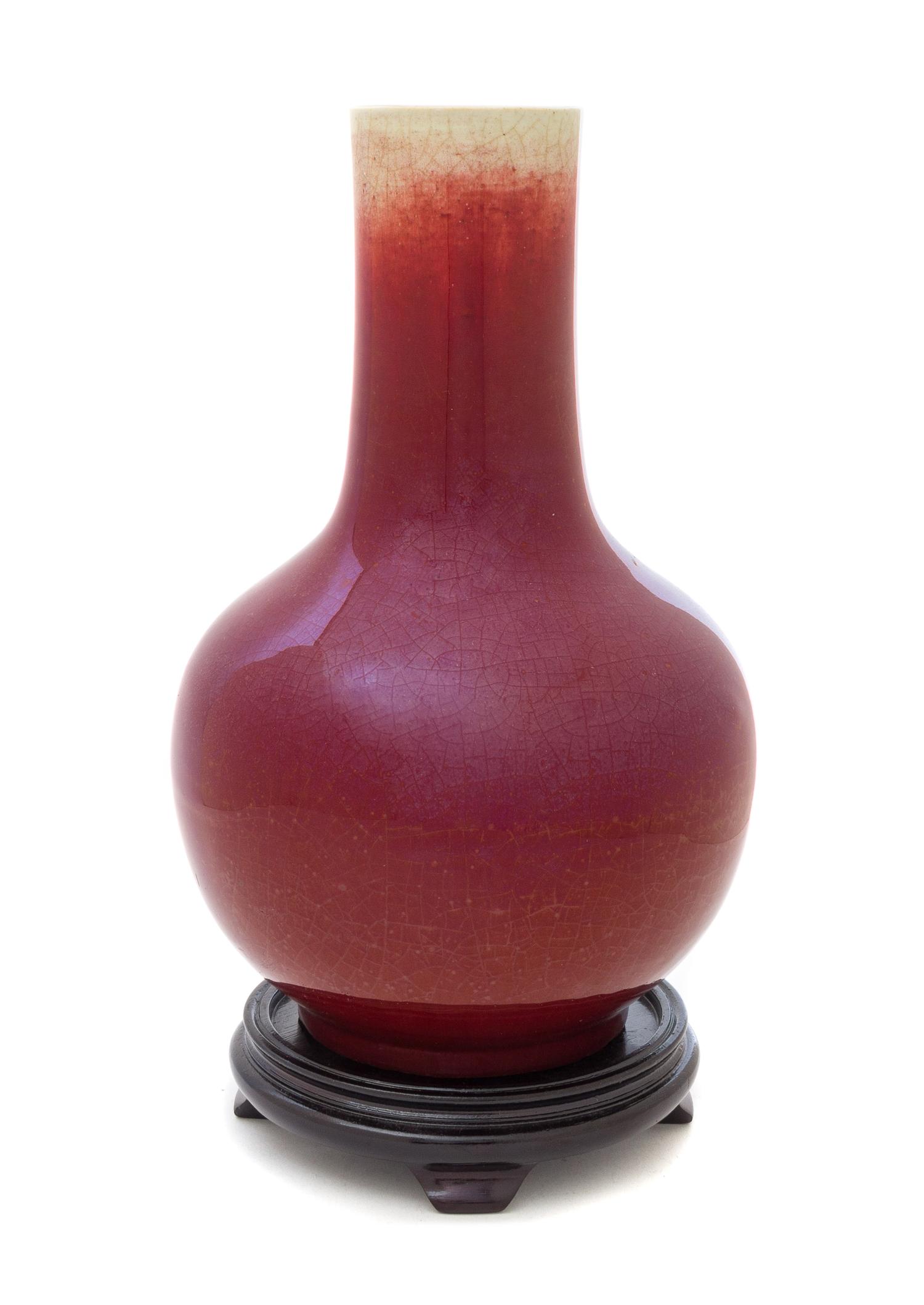 A Sang-de-Boeuf Glazed Porcelain Bottle Vase Height 12 1/2 inches. — MID-19TH CENTURY