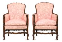 A Pair of French Provincial Louis XVI Style Walnut Bergeres Height 35 1/2 x width 25 x depth 23 inches. — 19TH CENTURY