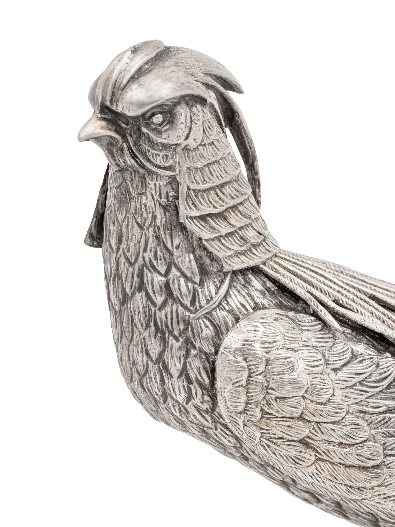 A Pair of Spanish Silver Pheasant Table Ornaments