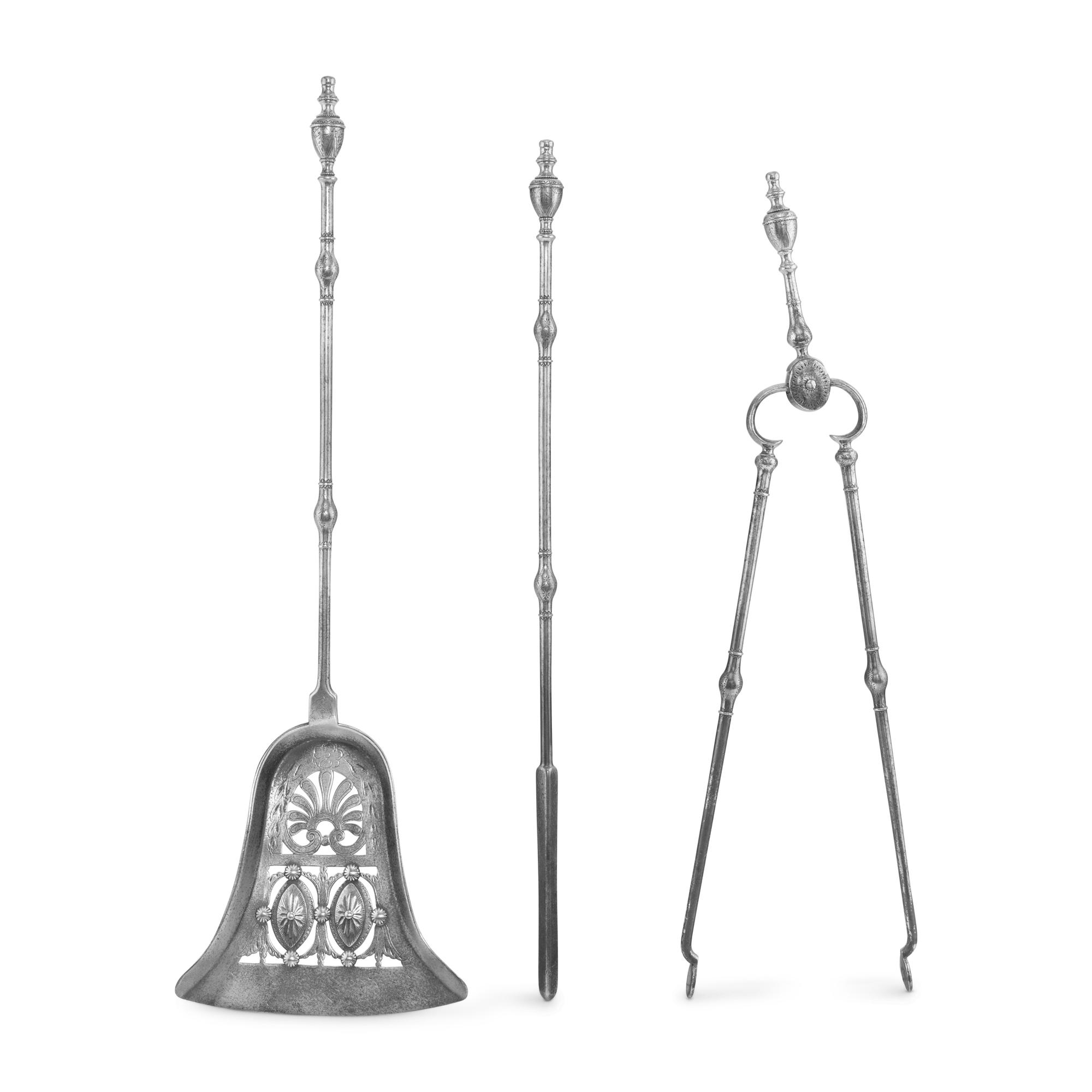 A George III Steel Serpentine Fender and Fireplace Tools