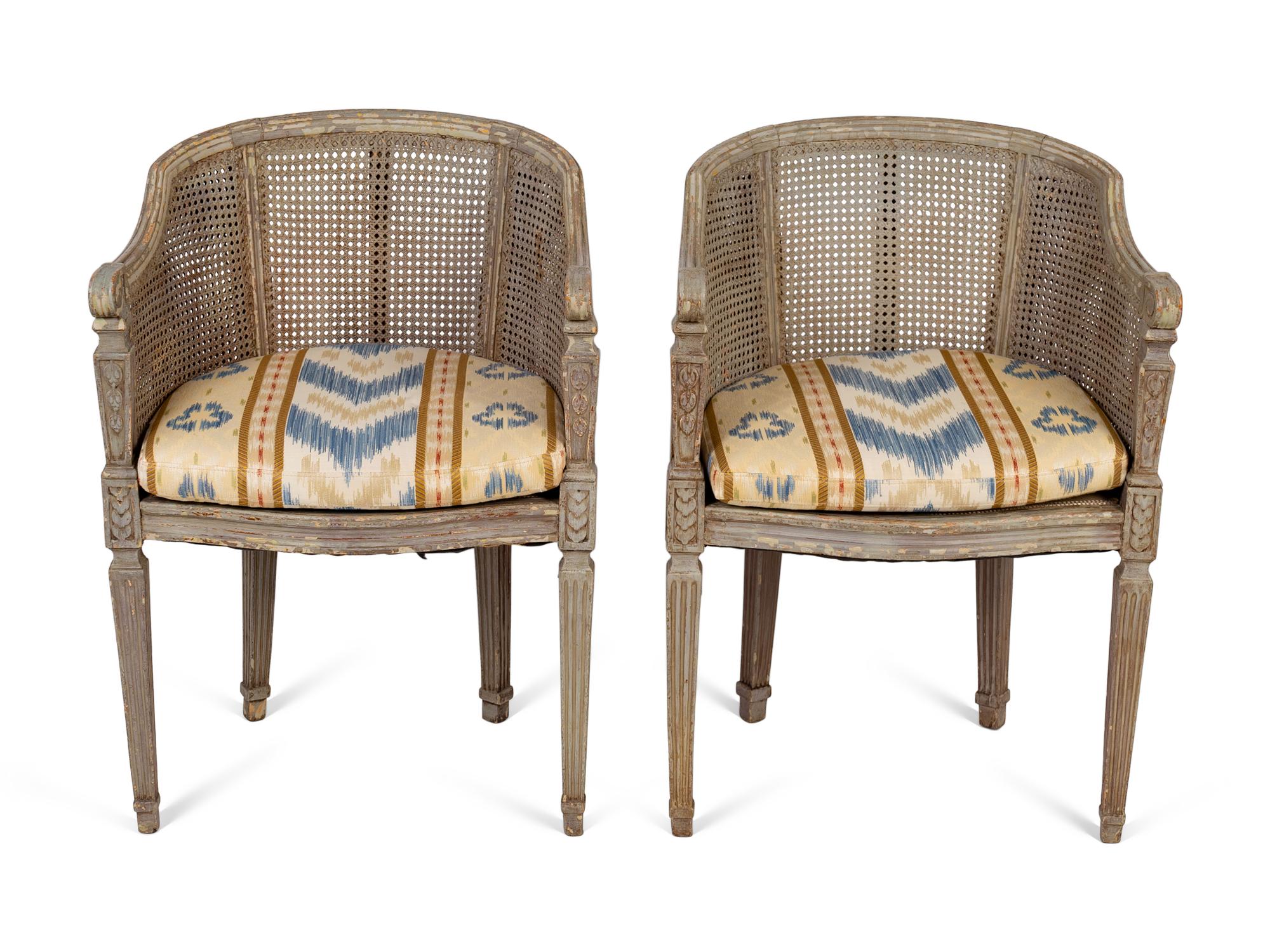 A Pair of Louis XVI Style Barrelback Cane and Painted Chairs — LATE 19TH CENTURY