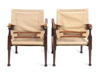 A Pair of British Colonial Style Mahogany, Canvas and Leather Strap Campaign Chairs — 20TH CENTURY