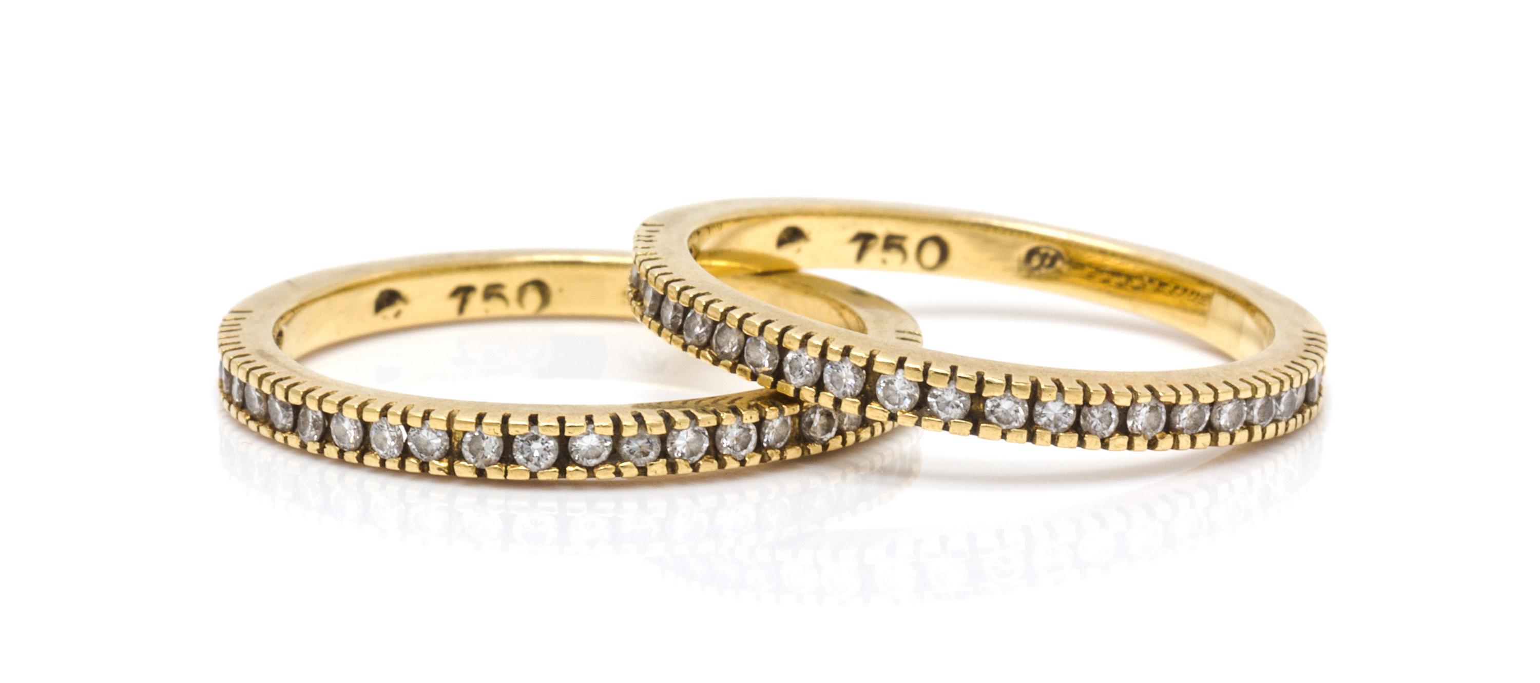 A Pair of 18 Karat Yellow Gold and Diamond Bands, 2.80 dwts.