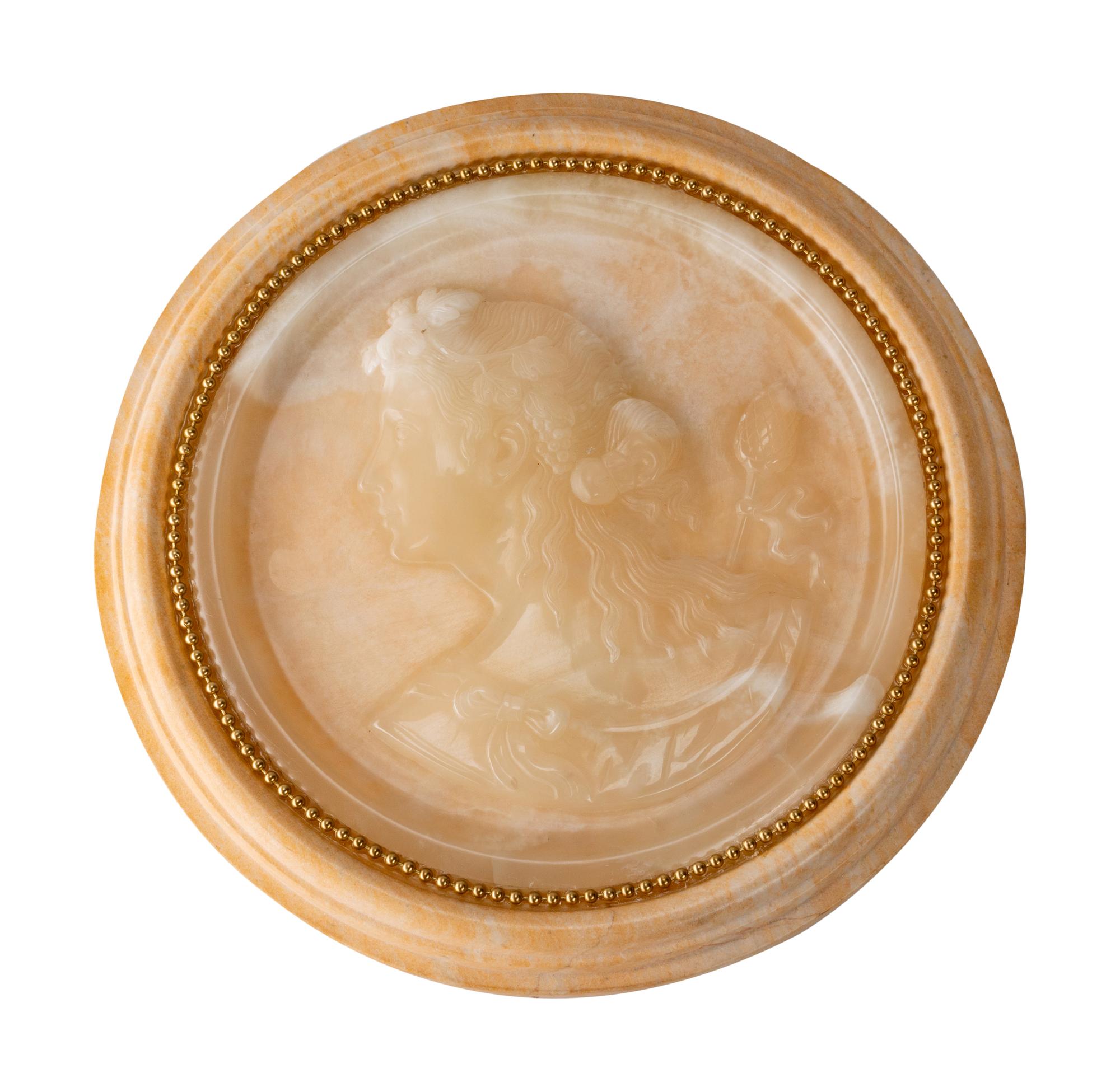 An Italian Carved Onyx Portrait Plaque in a Sienna Marble Frame