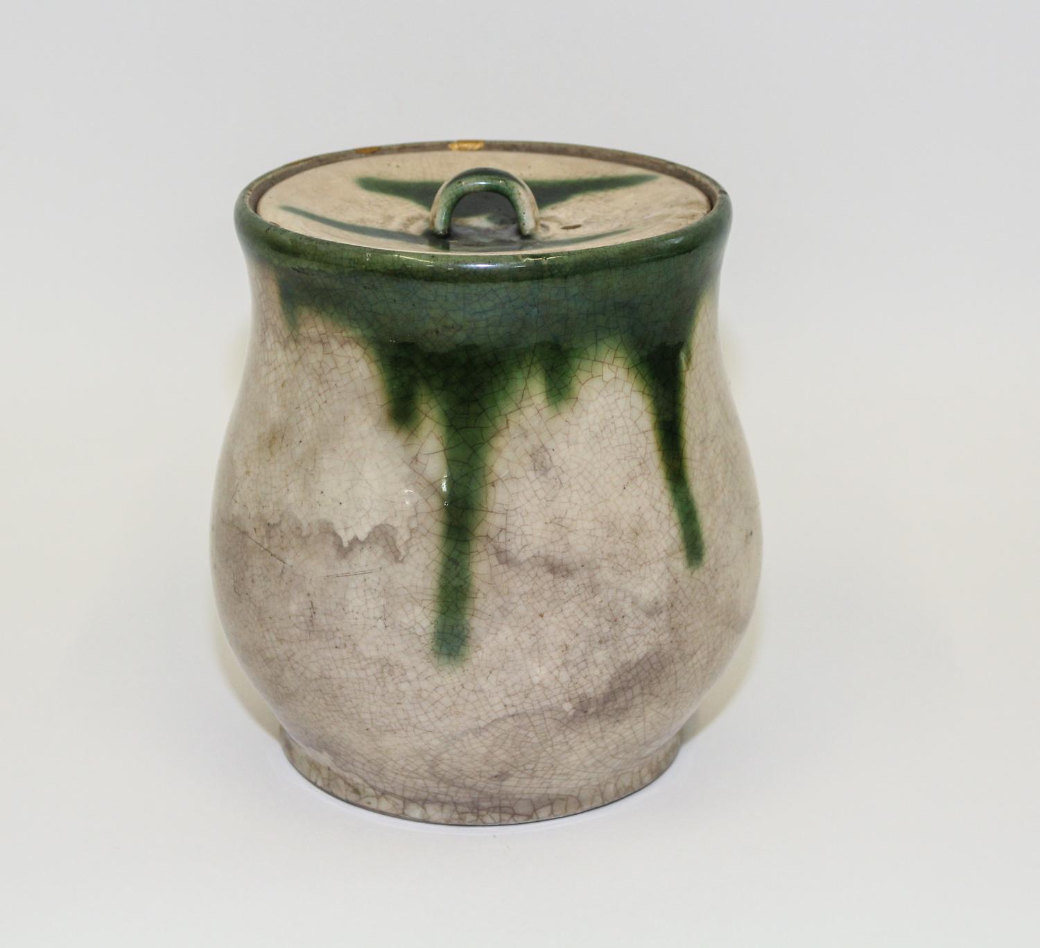 A Japanese Stoneware Jar and Cover Height 7 1/2 inches.